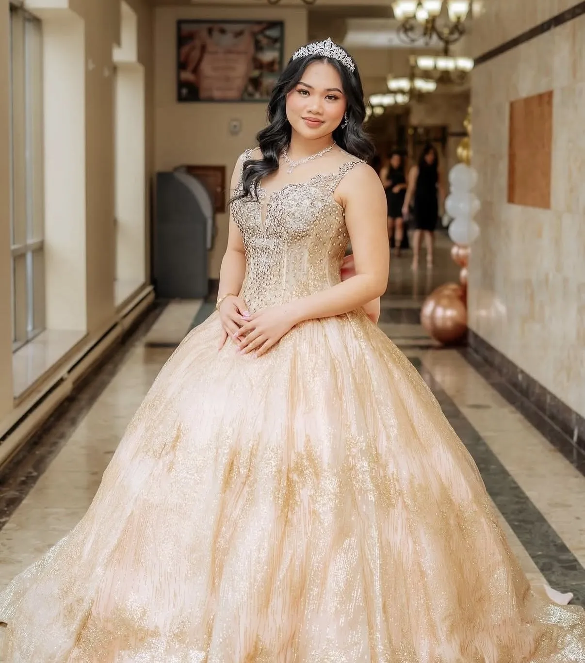 Guest of honour in a gold gown before the celebration